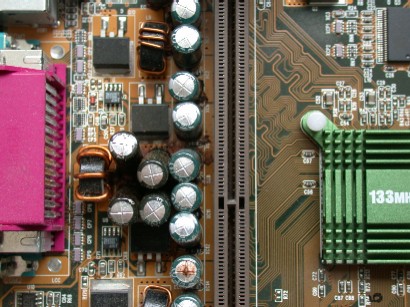 Capacitors near processor slot